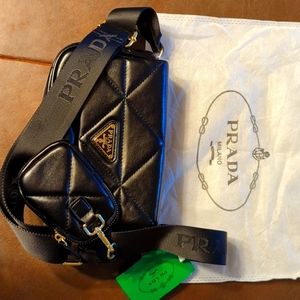 Prada purse with tags and dust covered.